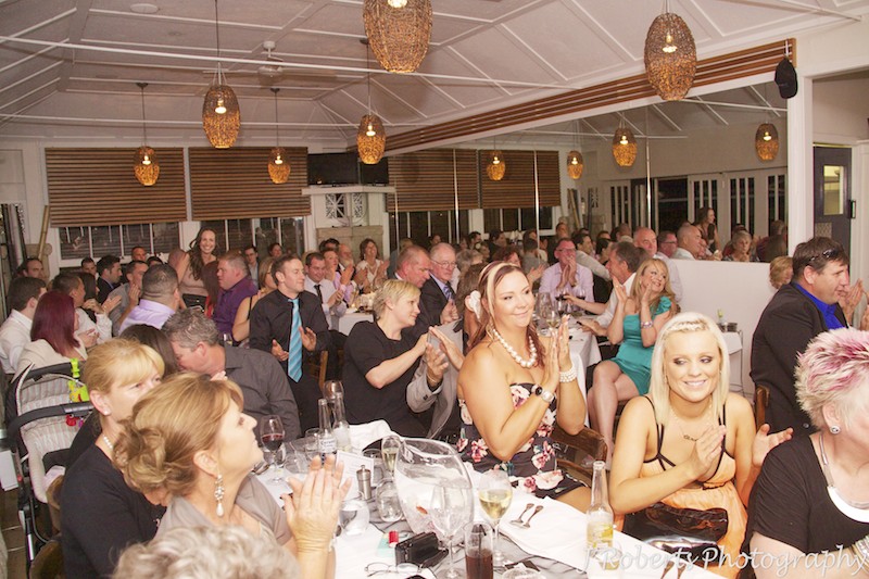 Guests clapping during wedding speeches - wedding photography sydney